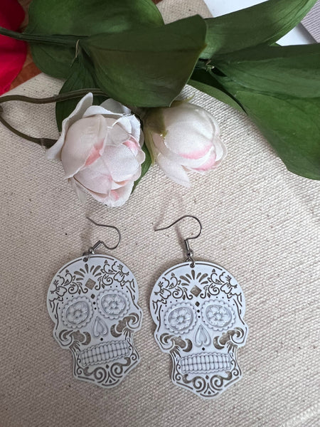 Boucles oreilles tête de squelette blanche Comme un ange